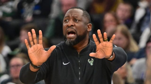 Milwaukee Bucks head coach Adrian Griffin calls a play 